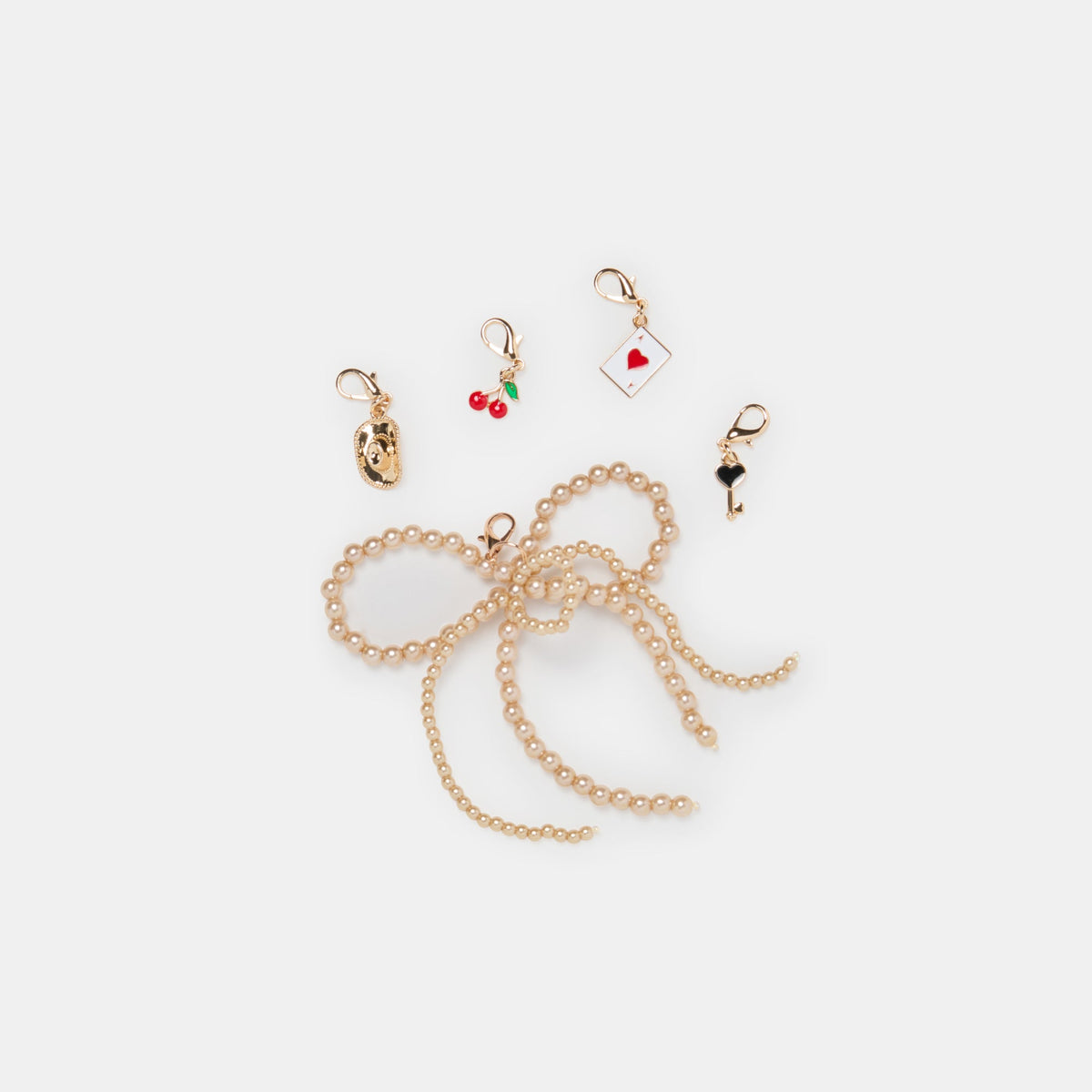 GOLD BOW CHARM PACKAGE ASSORTED - Dolce Vita